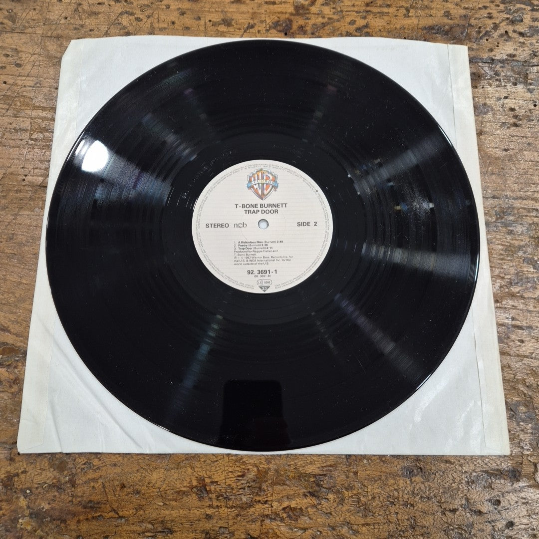 LP T-Bone Burnett - Trap Door 92 3691-1 Made In Germany Musica Rock Vinile