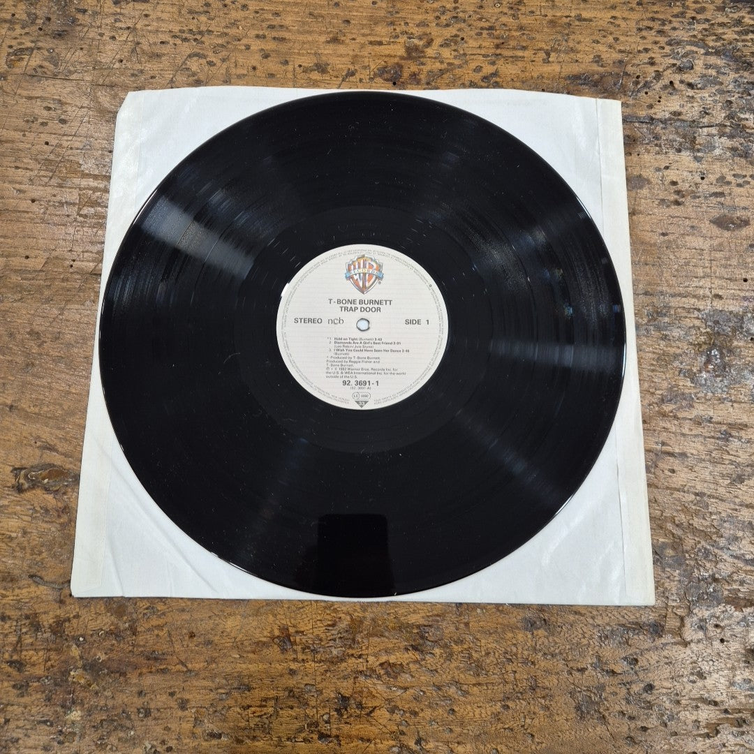 LP T-Bone Burnett - Trap Door 92 3691-1 Made In Germany Musica Rock Vinile
